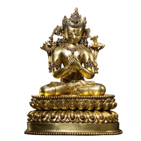 A Chinese Ming Dynasty gilt bronze statue of a seated Buddha
