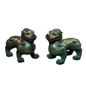 A pair of gold and silver inlaid auspicious beasts from the Warring States Period of China