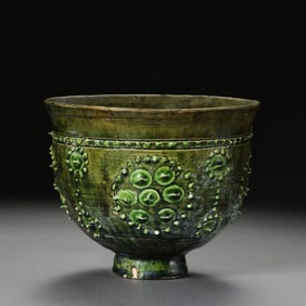 Chinese Sui Dynasty green-glazed bowl with drum-nail pattern