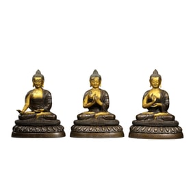 A group of partially gilded bronze seated Buddha statues from the Qianlong period of the Qing