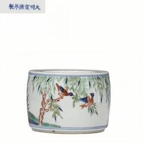 A Chinese multicolored cricket jar with a mandarin duck playing in water pattern, dating from the