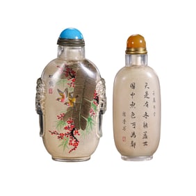 A pair of Chinese Qing Dynasty glazed snuff bottles with inner-painted flower and bird patterns