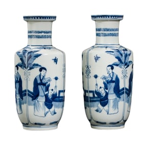A pair of Chinese Qing Dynasty blue and white vases with figures and stories
