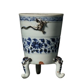 A Chinese Yuan Dynasty blue and white tripod furnace with dragon patterns