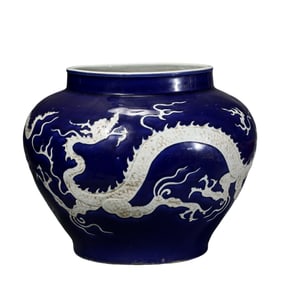 A Chinese Yuan Dynasty blue-glazed jar with white dragon pattern