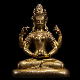 A Chinese Ming Dynasty gilt bronze statue of a seated Buddha