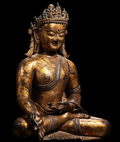 A Chinese Ming Dynasty gilt bronze statue of a seated Buddha