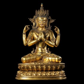 A Chinese Qing Dynasty gilt bronze statue of the God of Wealth