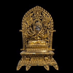 A Chinese gilt bronze statue of a seated Buddha from the Chenghua period of the Ming Dynasty