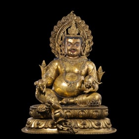 A Chinese Qing Dynasty gilded bronze statue of the God of Wealth