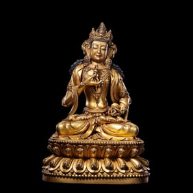 A Chinese gilt bronze statue of a seated Buddha from the Yongle period of the Ming Dynasty