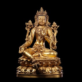 A Chinese gilt bronze statue of a seated Buddha from the Yongle period of the Ming Dynasty