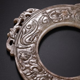 Warring States Period Hetian Jade Ring with Beast Mask Motifs