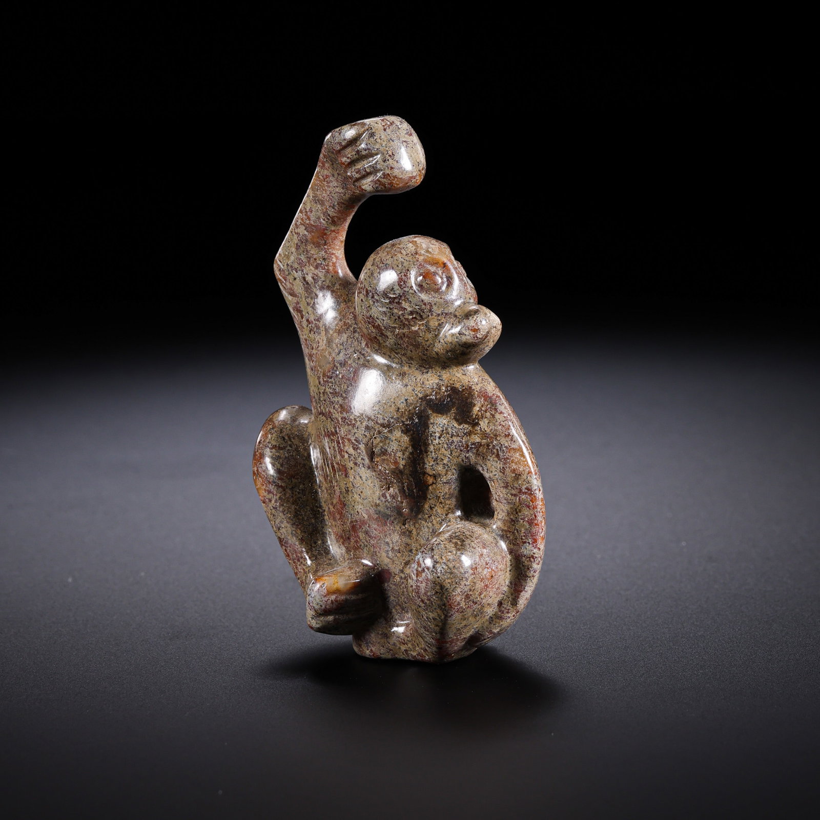 A Chinese Warring States Hetian Jade Monkey Pendant: 5th–3rd century BCE; Height: 5.5 cm; Width: 3.5 cm; Weight: 38 gCondition and Provenance?In good overall condition. The pendant is carved in the round from Hetian jade and shows tones ranging from c