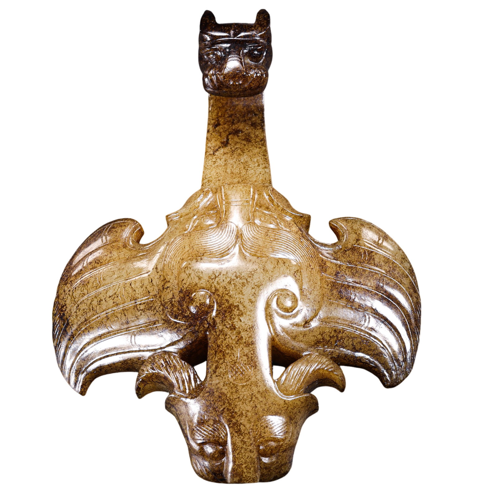 Warring States Period Hetian Jade Belt Hook, China: 5th–3rd century BCE; Length: 10.5 cm (approx. 4.13 in); Width: 8 cm (approx. 3.15 in); Weight: 139 gCondition and Provenance?In good overall condition. The belt hook is carved from Hetian jade and s
