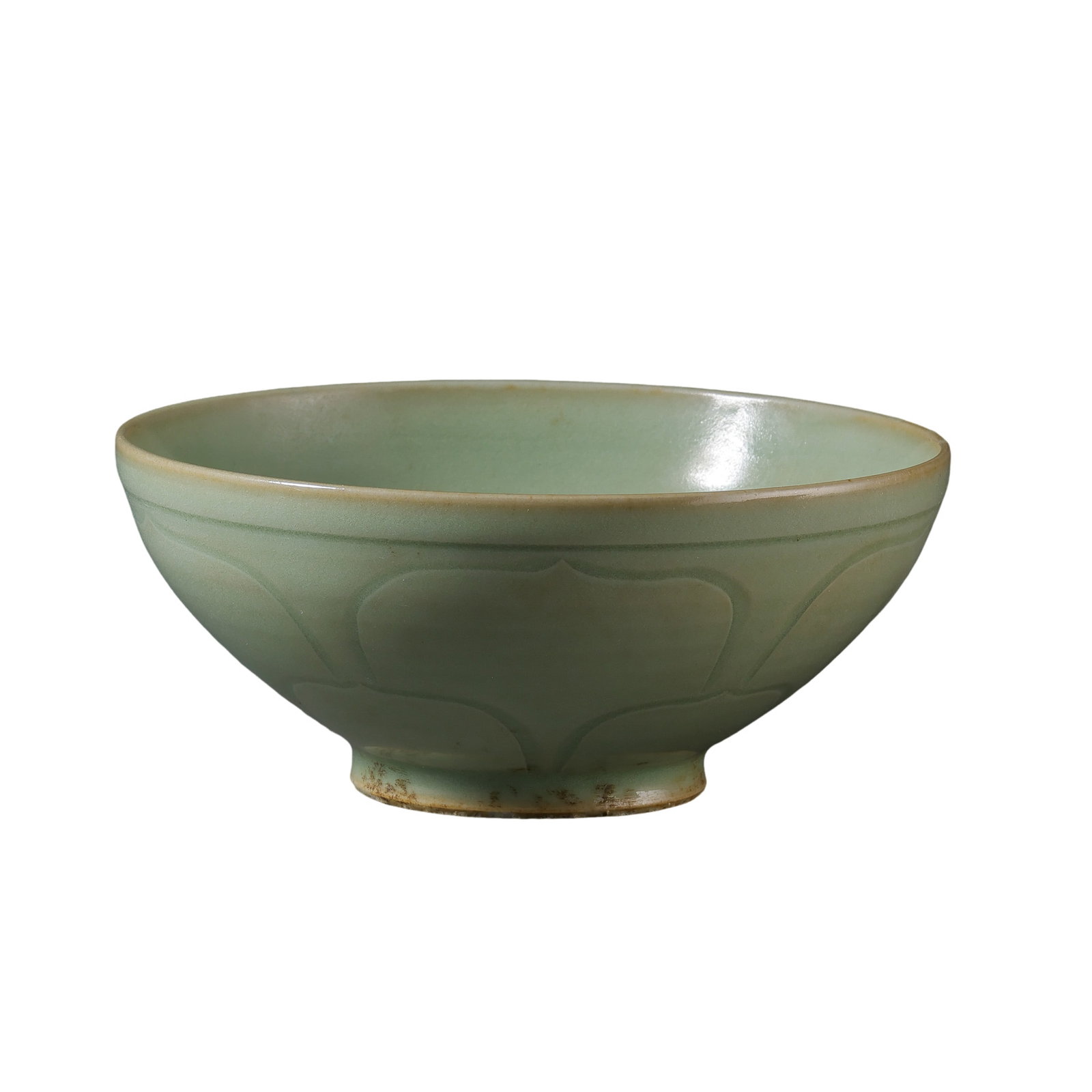 Five Dynasties Yaozhou Ware Celadon Carved Bowl: 10th century; Mouth diameter: 11.6 cm (approx. 4.57 in); Height: 5 cm (approx. 1.97 in)Condition and Provenance?In good overall condition. The bowl is complete in form and covered overall with a soft 