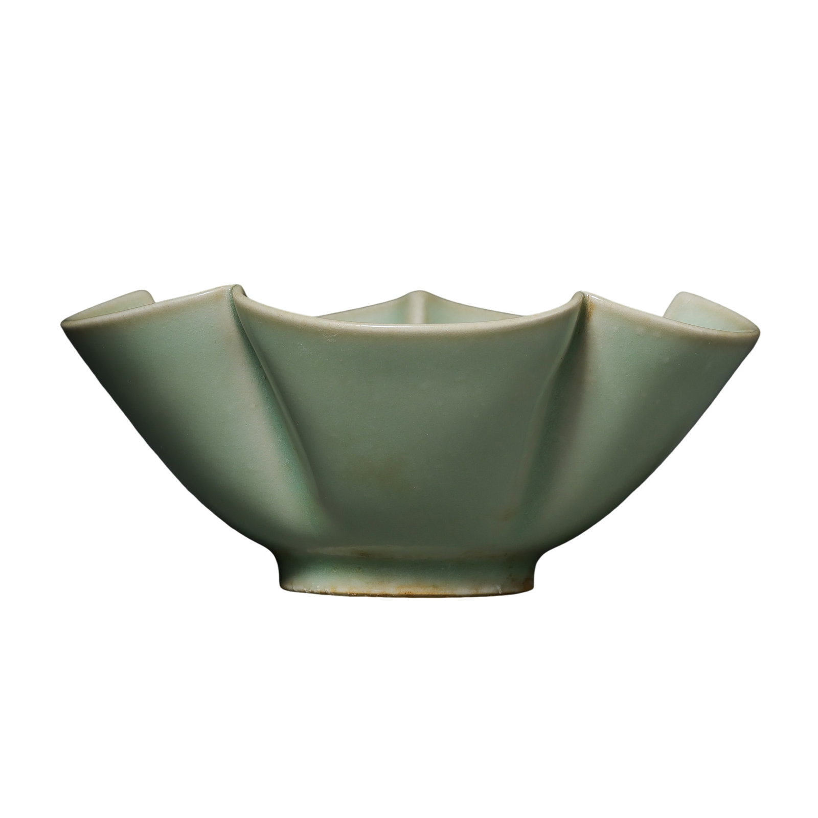 Five Dynasties Yaozhou Ware Celadon Foliate-Rim Cup: 10th century; Mouth diameter: 11.7 cm (approx. 4.61 in); Height: 4.7 cm (approx. 1.85 in)Condition and Provenance?In good overall condition. The cup is complete in form and covered overall with a soft