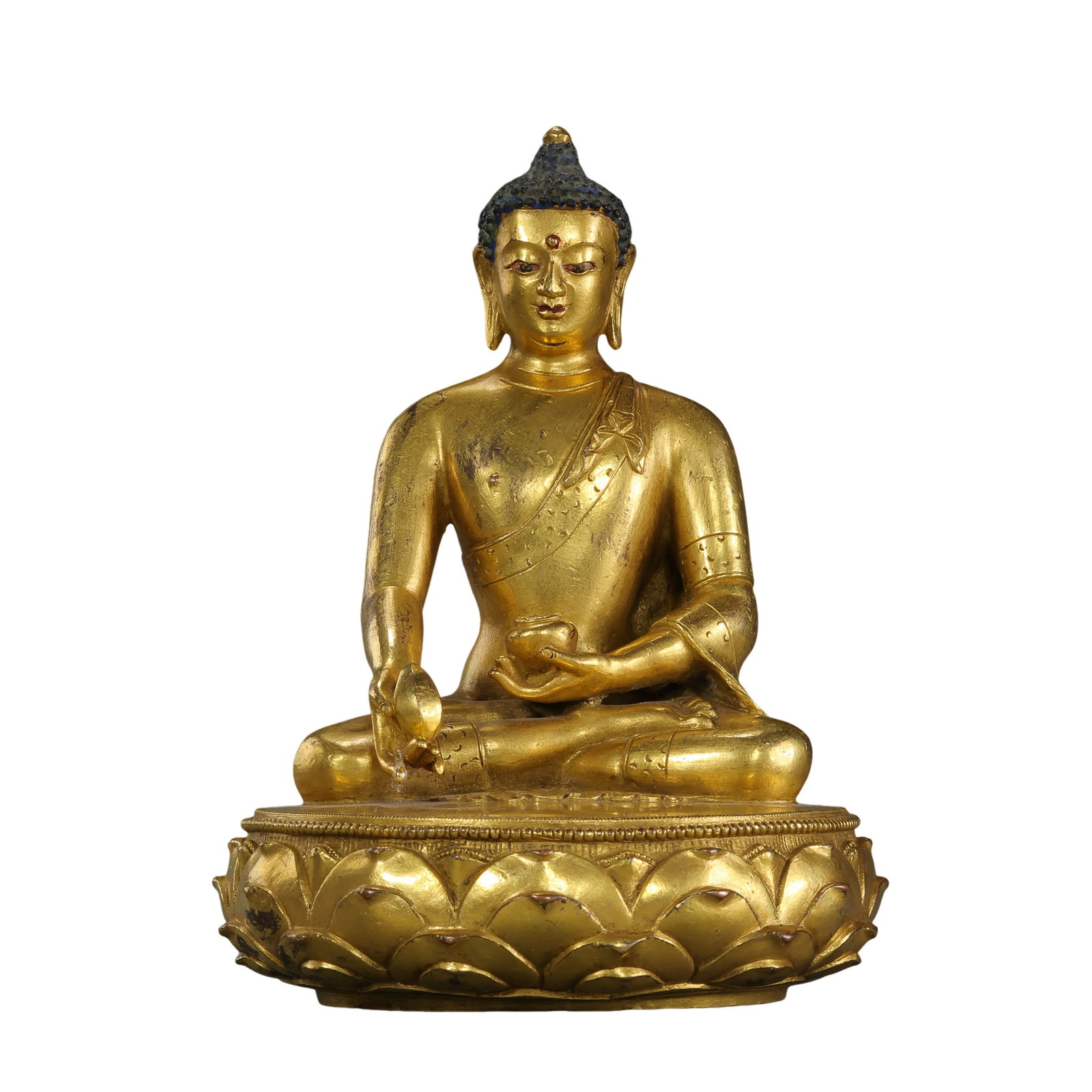 18th-Century Tibetan Gilt-Bronze Seated Shakyamuni Buddha: 18th century; height: 17 cm / 6.69 in; width: 12 cm / 4.72 in; weight: 1660 g / 58.55 ozCondition and Provenance?Condition: Overall in good condition. The figure and lotus base are structurally intact