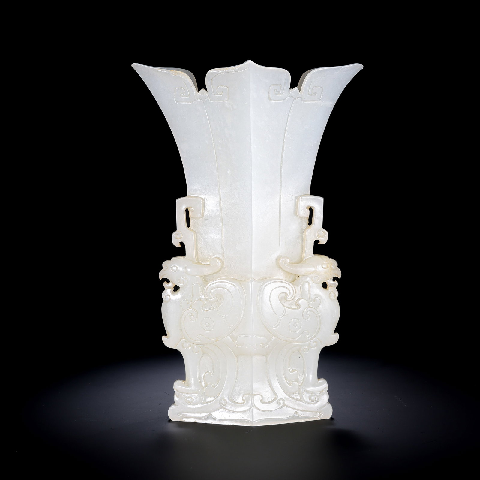 Qing Dynasty Hetian Jade Archaistic Gu-Form Vase with Animal-Mask Decoration: 18th–19th century; height: 16 cm / 6.30 in; width: 8 cm / 3.15 in; weight: 368 g / 12.98 ozCondition and Provenance?Condition: Overall in good condition. The Hetian jade is smooth and finely polishe