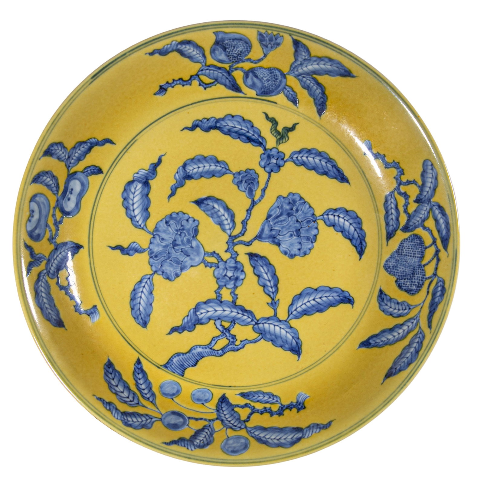 Chenghua Period, Ming Dynasty Yellow-Ground Blue and White Plate with Floral and Fruit Decoration: 15th century; Diameter: 29.5 cm, approximately 11.61 in, approximately 0.97 ftCondition and Provenance?Condition: Overall well preserved, with a regular form, bright yellow ground, and stable cobalt-b