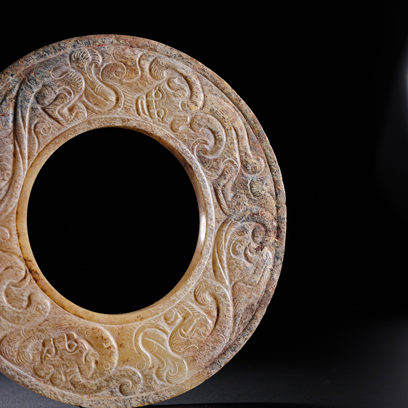 Warring States Period Hetian Jade Bi Disc with Carved Coiled-Serpent Decoration: 5th–3rd century BCE; Diameter: 10 cm, approximately 3.94 in, approximately 0.33 ft; Weight: 79 gCondition and Provenance?Condition: Overall well preserved. The Hetian jade has a warm surface with vi