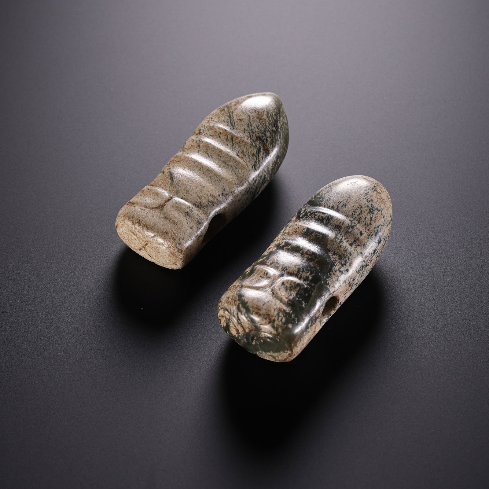 Neolithic Hongshan Culture Pair of River Jade Silkworm-Form Pendants: c. 750000–2900 BCE; Length of each: 5.6 cm, approximately 2.20 in, approximately 0.18 ft; Total weight: 85 gCondition and Provenance?Condition: Overall well preserved. The jade has a warm, smooth