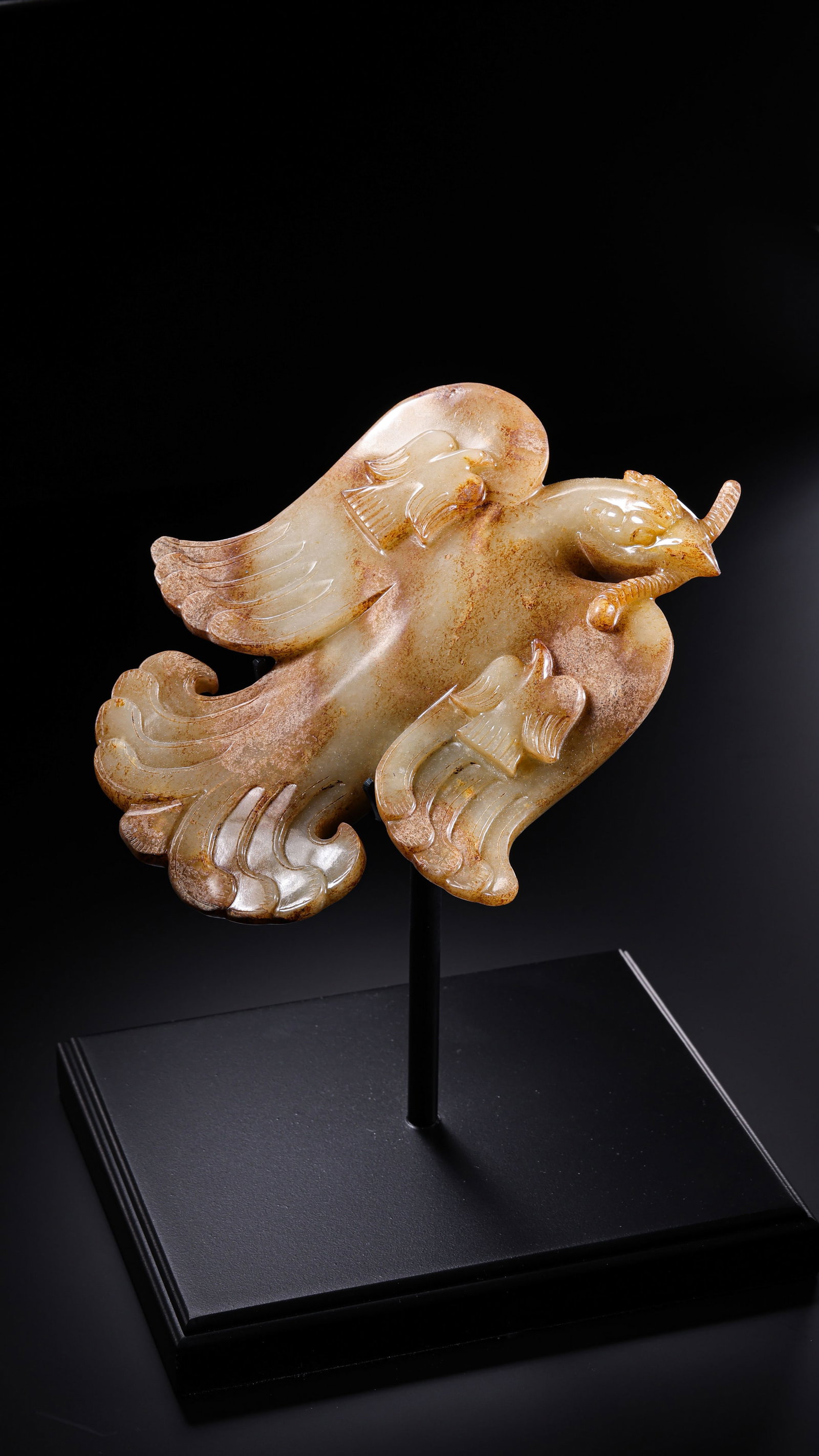 Warring States Period Hetian Jade Phoenix Pendant: 5th–3rd century BCE; L. 17 cm (6.69 in; 0.56 ft); W. 13.5 cm (5.31 in; 0.44 ft); Weight: 831 gCondition & Provenance?Condition: Overall well preserved. The jade is smooth and finely textured with a 