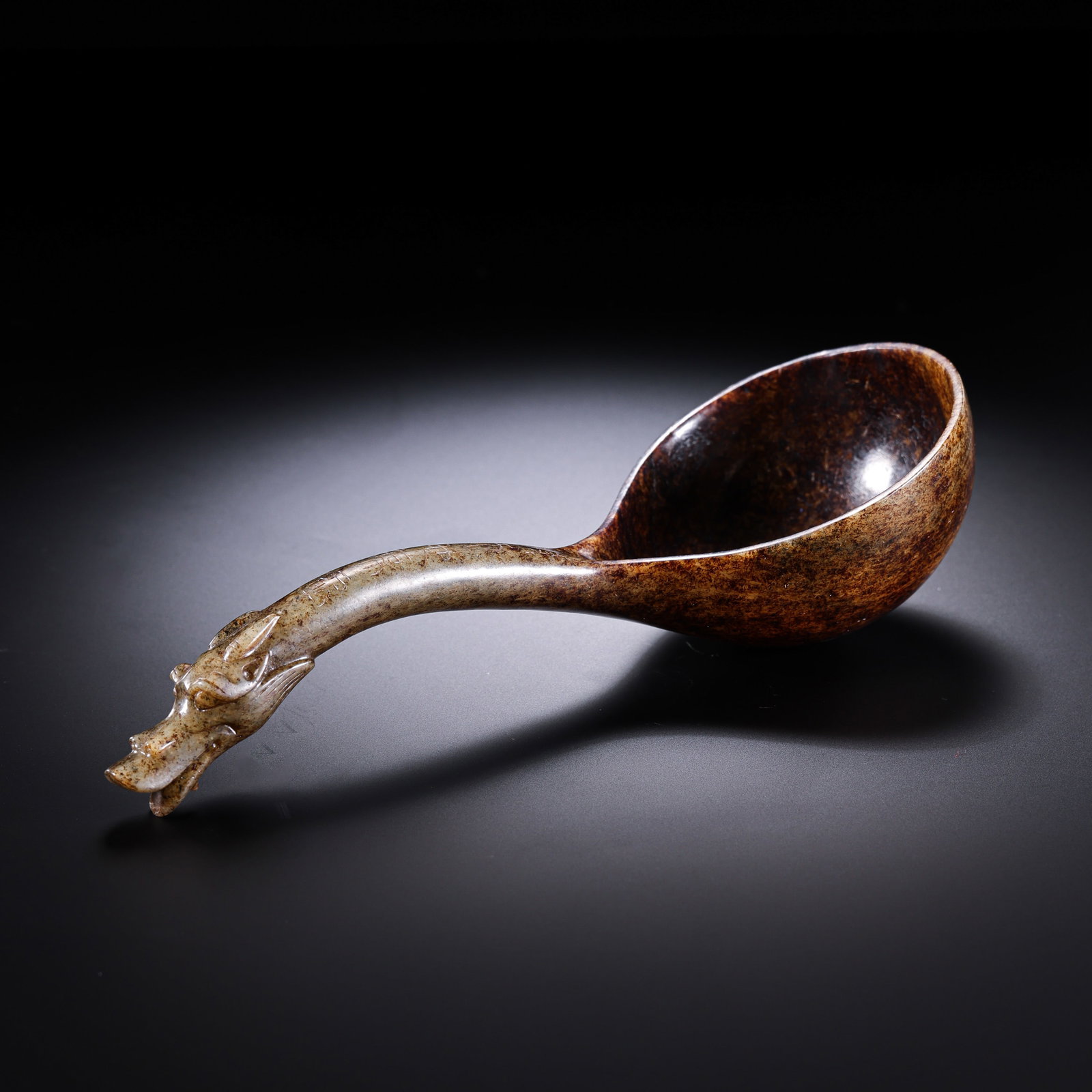 Warring States Period Hetian Jade Spoon with Dragon-Head Handle: 5th–3rd century BCE; L. 19 cm (7.48 in; 0.62 ft); H. 6.7 cm (2.64 in; 0.22 ft); Weight: 120 gCondition & Provenance?Condition: Overall in good condition. The jade is fine and smooth, with natural br