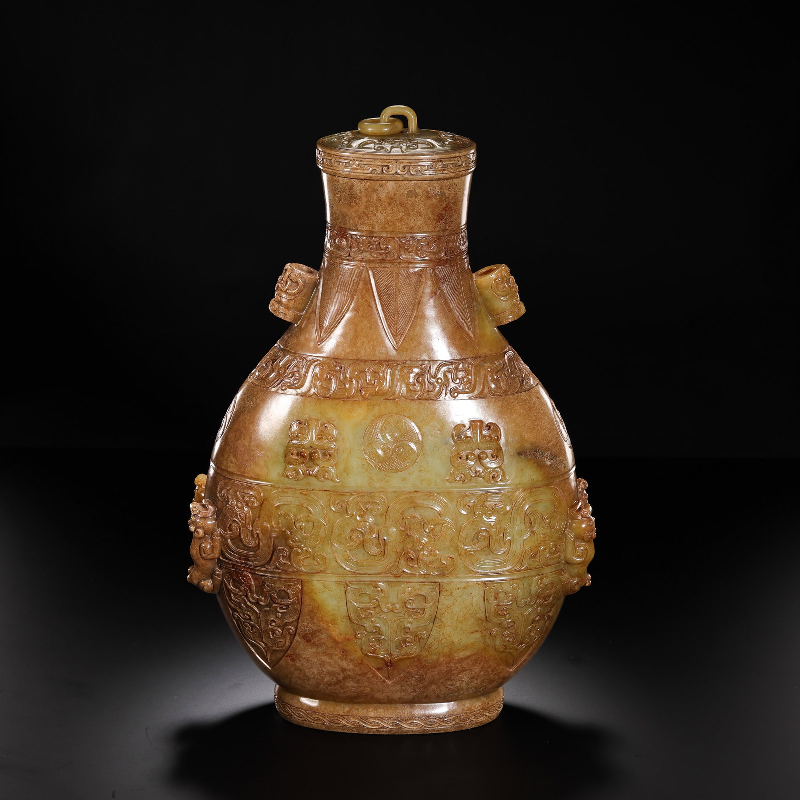 Warring States Period Hetian Jade Covered Vessel with High-Relief Zoomorphic Decoration: 5th–3rd century BCE; H. 34 cm (13.39 in; 1.12 ft); W. 22 cm (8.66 in; 0.72 ft); Weight: 3442 gCondition & Provenance?Condition: Overall in good condition. The jade is smooth and finely textured, wit