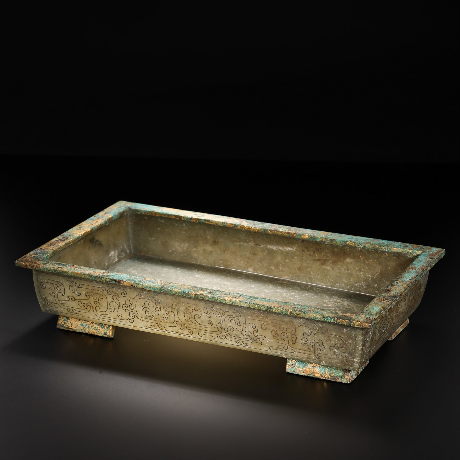 Warring States Period Hetian Jade Rectangular Tray with Kui Dragon Pattern: 5th–3rd century BCE; L. 29.8 cm (11.73 in; 0.98 ft); H. 6 cm (2.36 in; 0.20 ft); Weight: 876 gCondition & Provenance?Condition: Overall in good condition. The jade is dense and finely textured, with