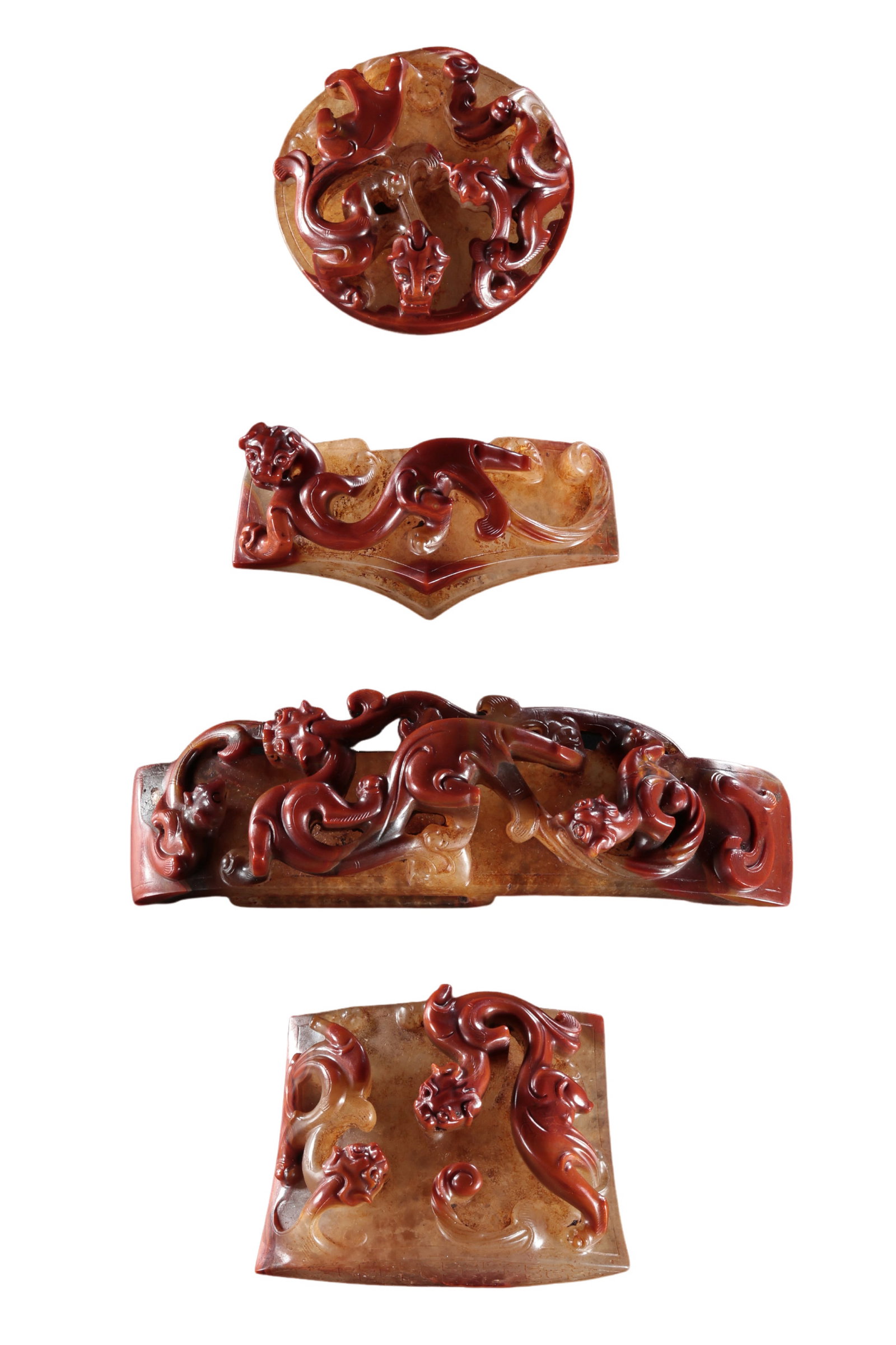 Warring States Period Red Agate Sword Fittings with Dragon Motifs: 5th–3rd century BCE; largest fitting L. 12.4 cm (4.88 in; 0.41 ft); other pieces approx. 5.7–7 cm (2.24–2.76 in; 0.19–0.23 ft); Weight: 424 gCondition & Provenance?Condition: Overall well pres