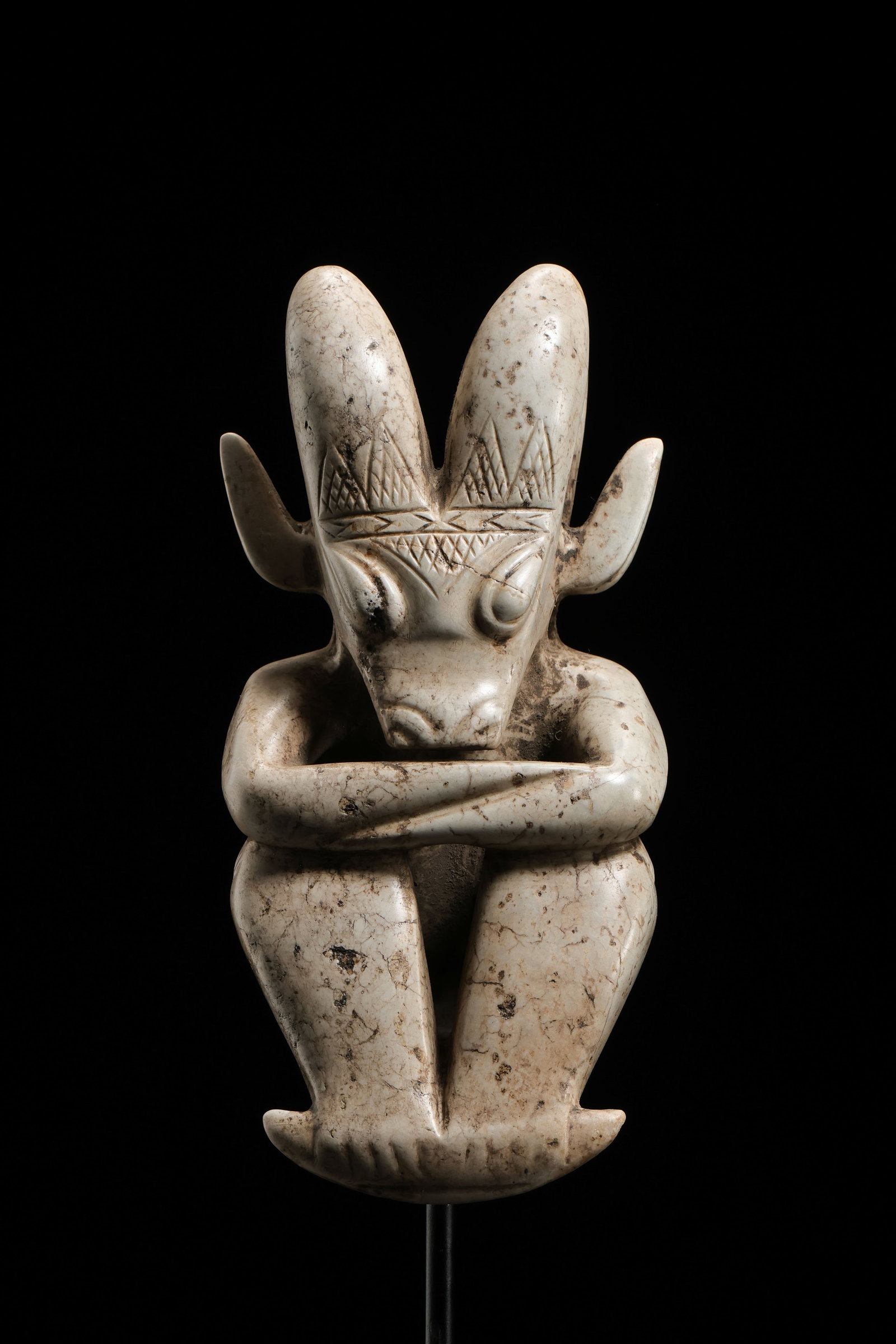 Neolithic Hongshan Culture, Chicken-Bone White Hetian Jade “Sun Deity?? Figure: Figure H. 13.5 cm (5.31 in; 0.44 ft); overall H. with stand 23 cm (9.06 in; 0.75 ft); W. 6.5 cm (2.56 in; 0.21 ft); Weight: 311 gCondition & Provenance?Condition: Overall well preserved. The jade has 