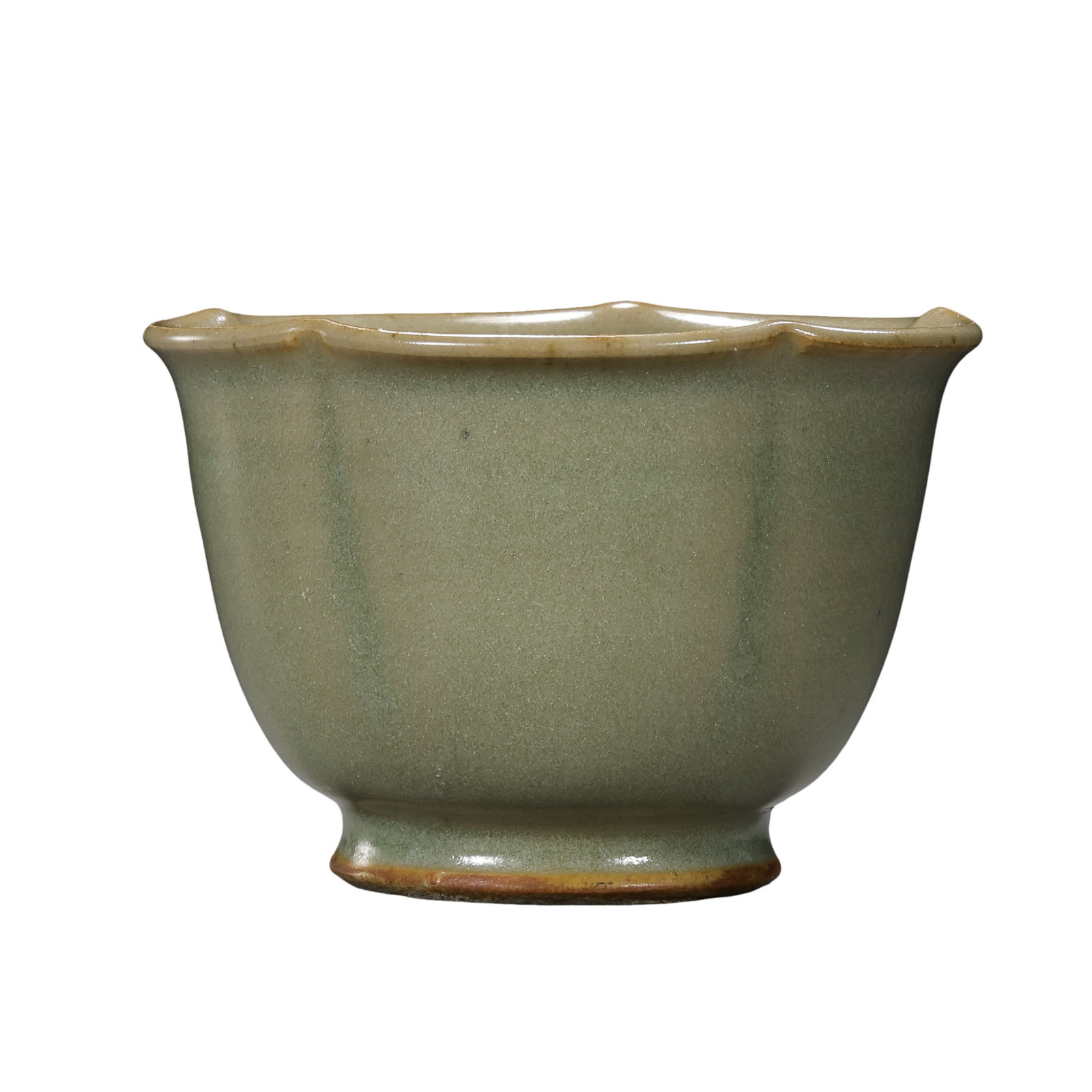 Five Dynasties Yaozhou Ware Celadon-Glazed Lobed Bowl: 10th Century; H. 5.5 cm, Diam. 8 cm; H. approx. 2.17 in, Diam. approx. 3.15 inCondition and Provenance: Good condition, with an overall intact form, a smooth lustrous glaze, and minor age-related wear