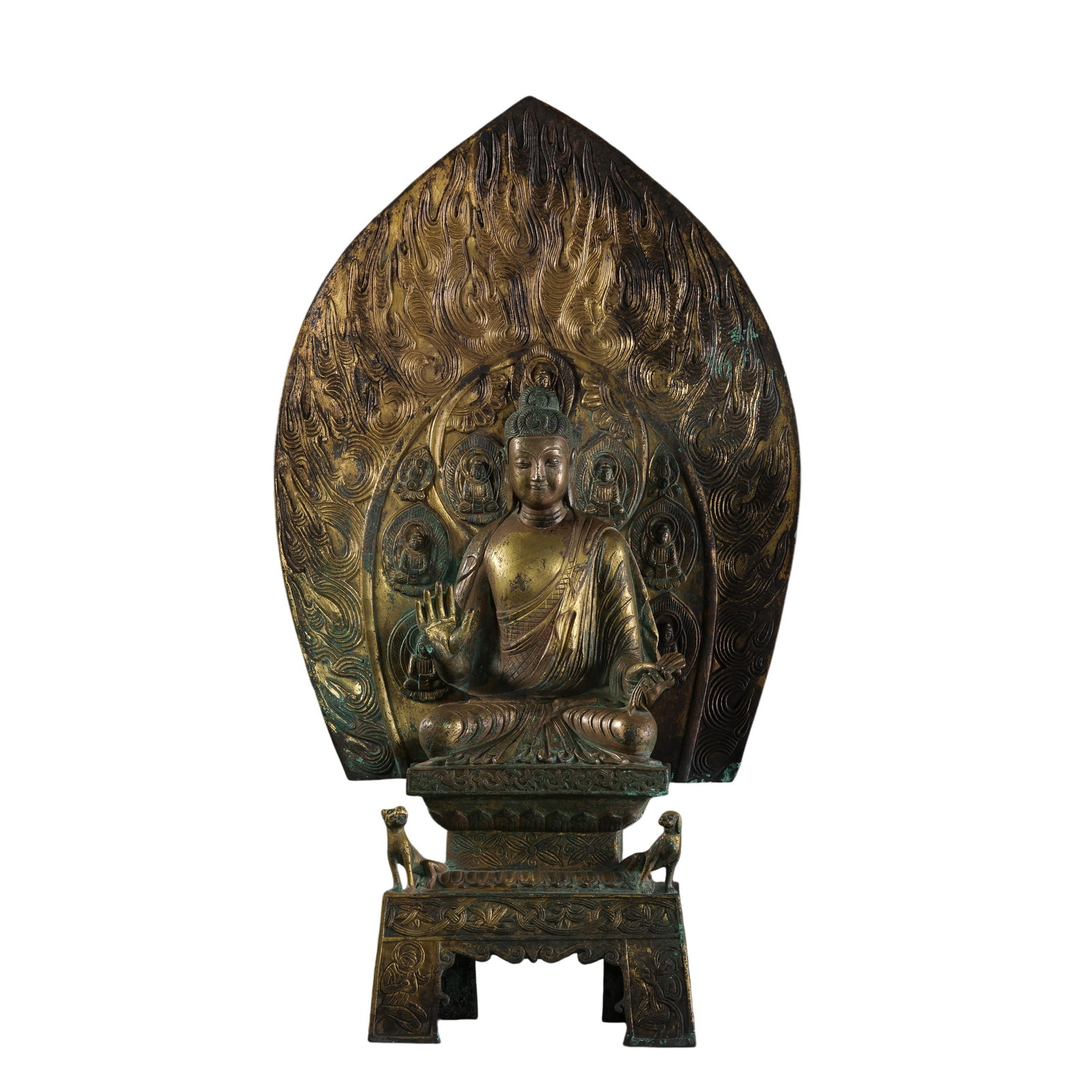 Northern Wei Dynasty Gilt Bronze Seated Buddha with Aureole: 5th–6th Century; H. 49.5 cm, W. 28 cm; Weight 6274 g; H. approx. 19.49 in, W. approx. 11.02 inCondition and Provenance: Good condition, structurally stable, with partial wear to the gilt surface, na
