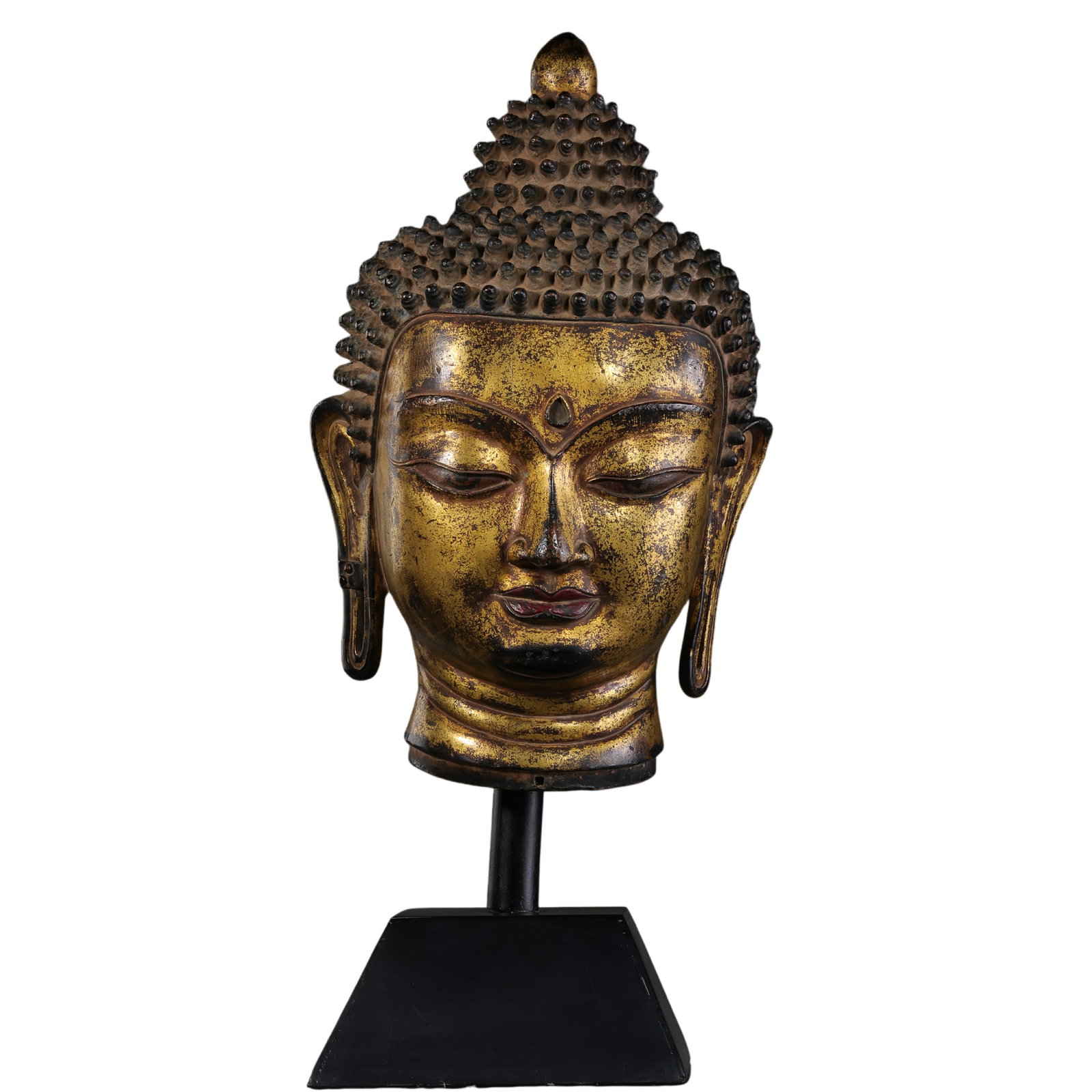 Tibetan Gilt-Bronze Head of Buddha, 15th Century: 15th Century; Buddha head H. 30 cm, overall H. with stand 46 cm; Weight 8799 g; head H. approx. 11.81 in, overall H. approx. 18.11 inCondition and Provenance: Good condition, with the facial features 