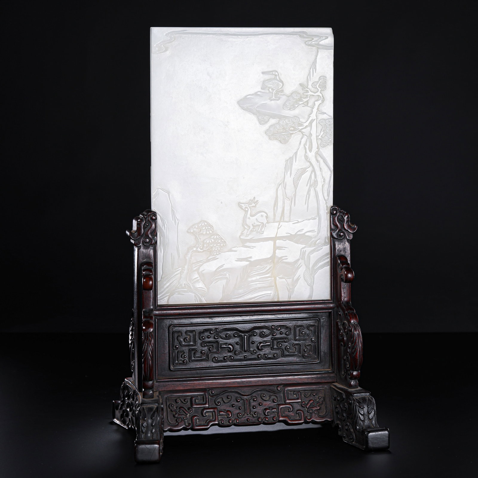 Qing Dynasty Hetian Jade Table Screen with Landscape, Deer, and Crane Design: 18th–19th Century; jade panel H. 15 cm, W. 15 cm; overall H. with stand 33.2 cm; Weight 1639 g; jade panel H. approx. 5.91 in, W. approx. 5.91 in; overall H. approx. 13.07 inCondition and Provenance