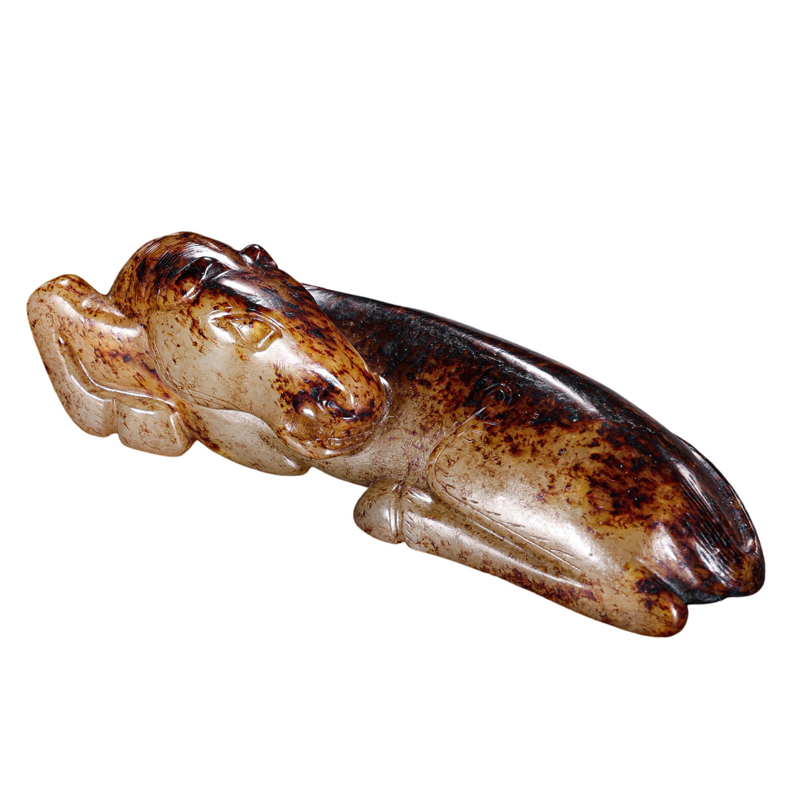 Han Dynasty Hetian Jade Recumbent Horse: 2nd Century BCE–2nd Century CE; L. 9 cm, H. 2.9 cm; Weight 81 g; L. approx. 3.54 in, H. approx. 1.14 inCondition and Provenance: Good condition, with the overall form intact, warm jade texture, natu