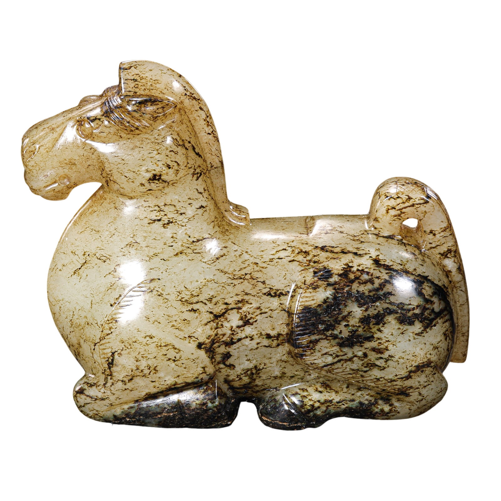 Han Dynasty Hetian Jade Recumbent Horse: 2nd Century BCE–2nd Century CE; L. 7.5 cm, H. 6.9 cm; Weight 227 g; L. approx. 2.95 in, H. approx. 2.72 inCondition and Provenance: Good condition, with the overall form intact, warm and substantial