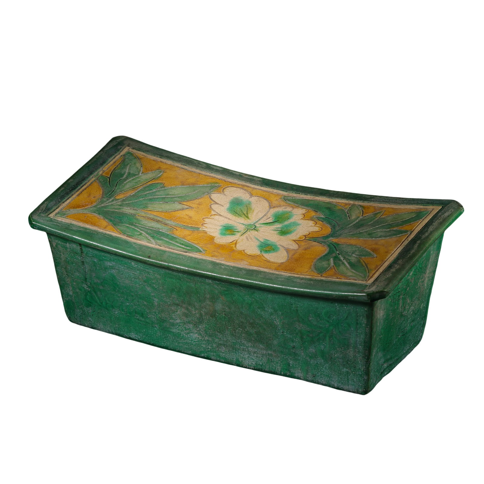 Tang Dynasty Sancai Rectangular Pillow with Floral Design: 7th–10th Century; L. 33 cm, W. 15.8 cm, H. 12.5 cm; L. approx. 12.99 in, W. approx. 6.22 in, H. approx. 4.92 inCondition and Provenance: Good condition, with the overall form intact, naturally aged 
