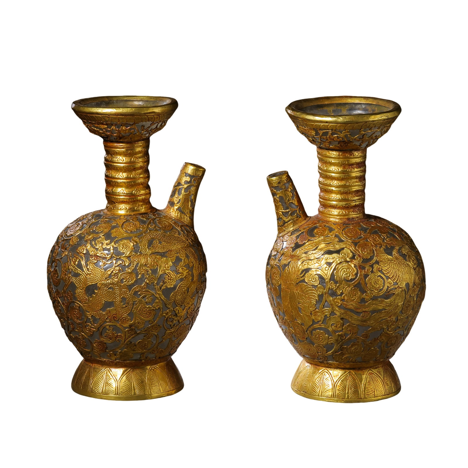 Pair of Liao Dynasty Rock Crystal Ewers with Gold Overlay Dragon and Phoenix Design: 10th–12th Century; H. 22.2 cm, mouth Diam. 11.5 cm; total weight 3542 g; H. approx. 8.74 in, mouth Diam. approx. 4.53 inCondition and Provenance: Good condition, preserved as a pair, with the overal