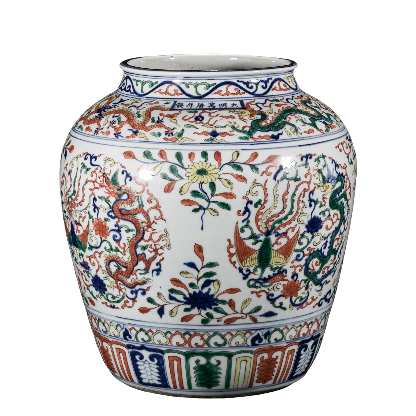 A Wucai “Dragon and Phoenix?? Jar, Wanli Period, Ming Dynasty: approx. 28 cm (11.0 in), Rim Diameter: approx. 18 cm (7.1 in), Base Diameter: approx. 20 cm (7.9 in), 16th CenturyCondition & Provenance:?In good condition, with a glossy glaze surface. Minor kiln imp