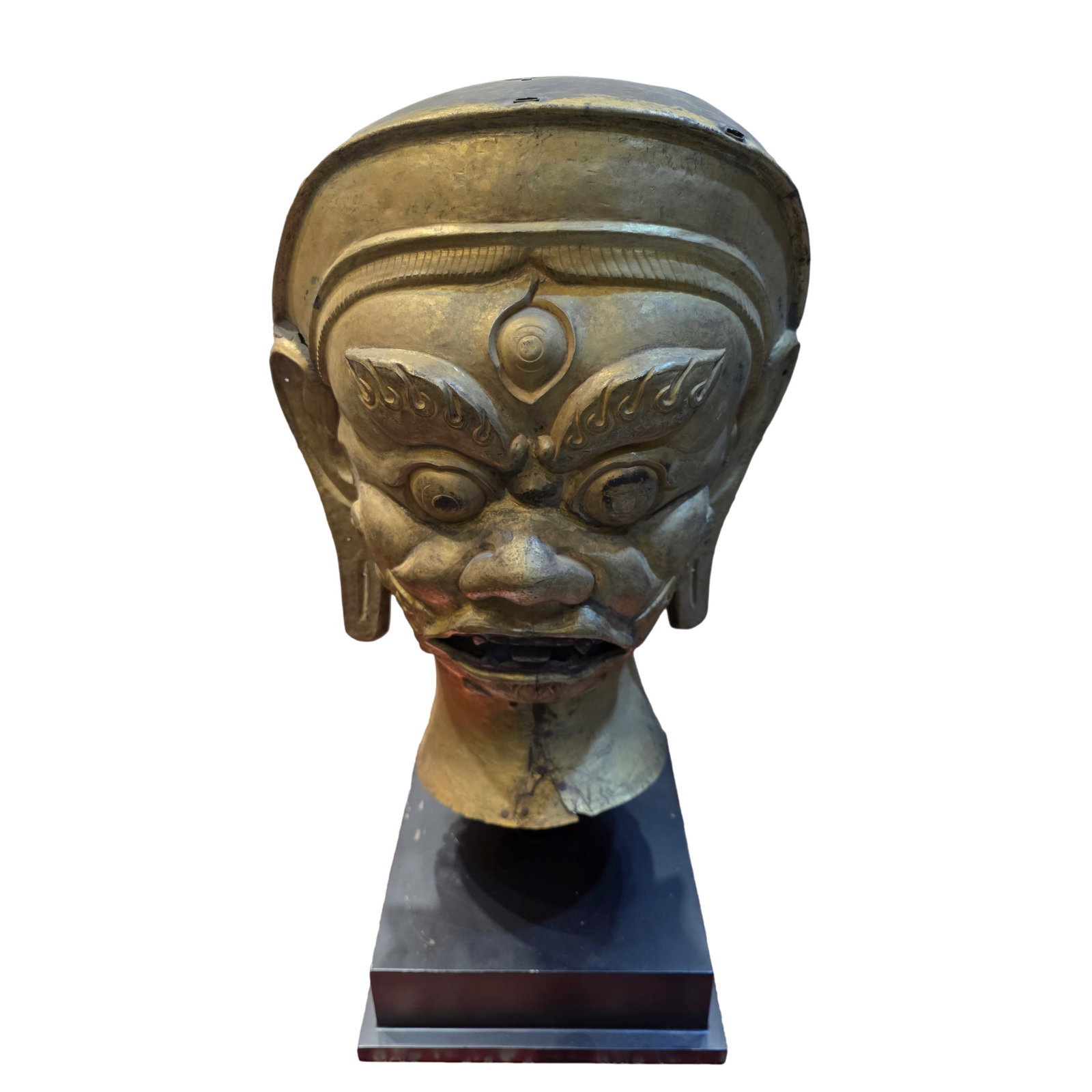 Tibetan or Himalayan Gilt-Copper Wrathful Guardian Mask, 18th–19th Century: approx. 50 cm (19.7 in), Width: approx. 39 cm (15.4 in), 18th–19th CenturyCondition & Provenance:?In good condition overall, with the form well preserved. The surface shows natural oxidation, locali