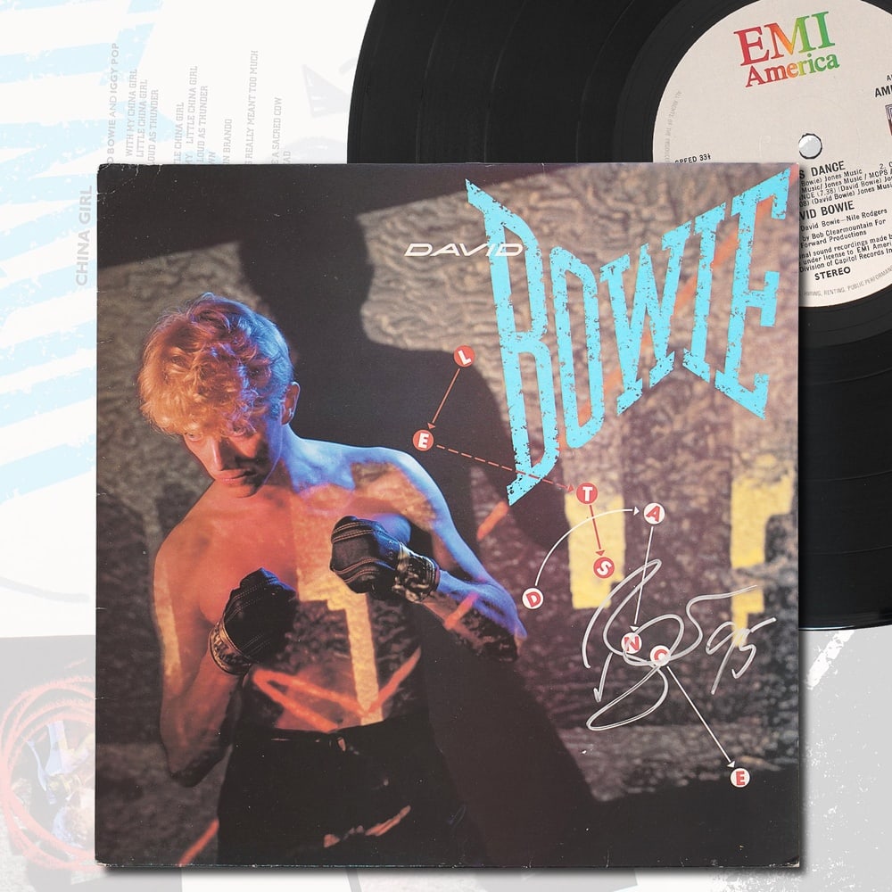 DAVID BOWIE SIGNED "LET'S DANCE" LP: 12 1/4 x 12 1/4 in Provenance and Authentication: This collectible has undergone a rigorous forensic evaluation. The signatures were carefully analyzed across multiple criteria, including ink