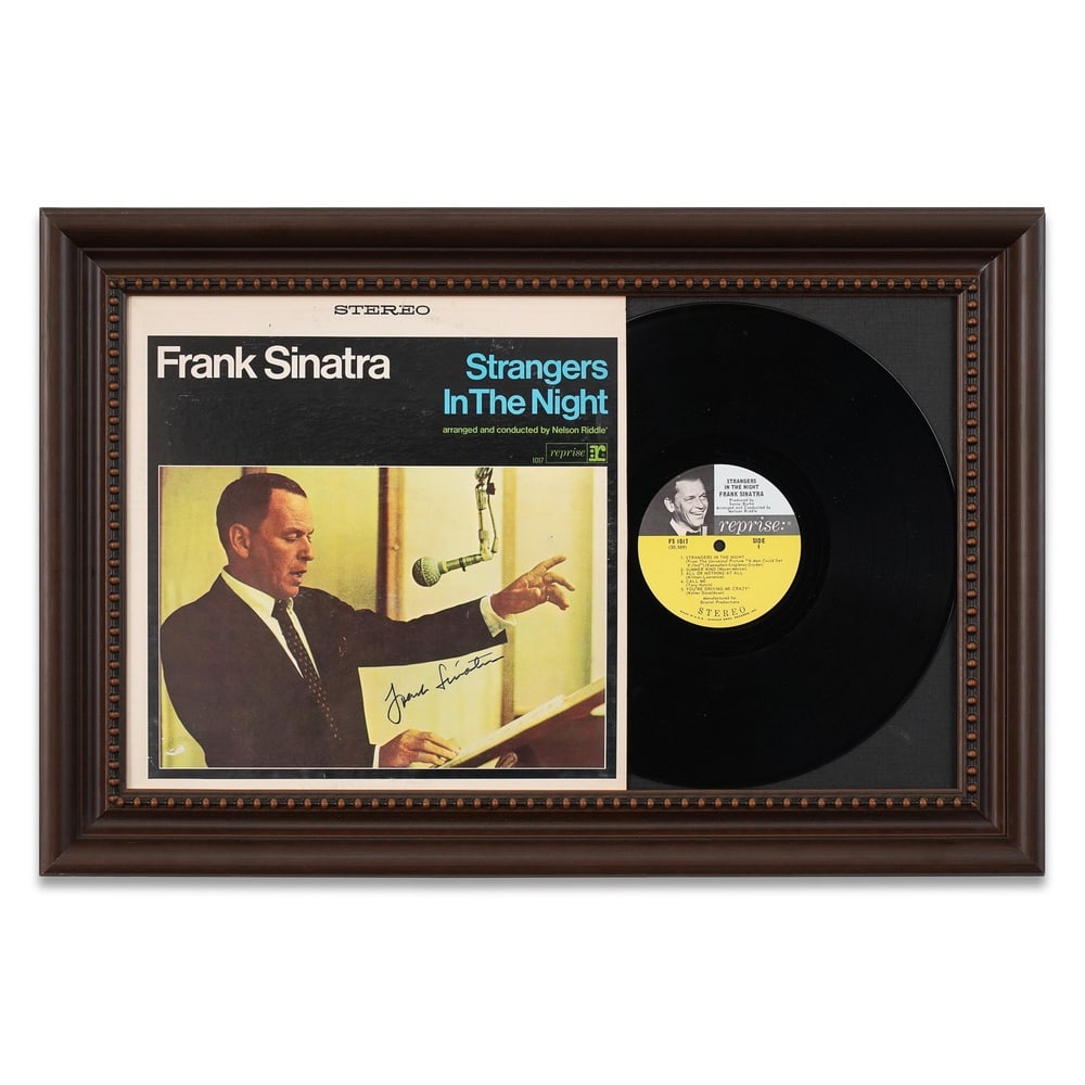 FRANK SINATRA SIGNED "STRANGERS IN THE NIGHT" LP DISPLAY: Framed Dimensions: 16 3/8 x 24 5/8 in (41.5 x 62.5 cm) Provenance and Authentication: This collectible has undergone a rigorous forensic evaluation. The signatures were carefully analyzed across