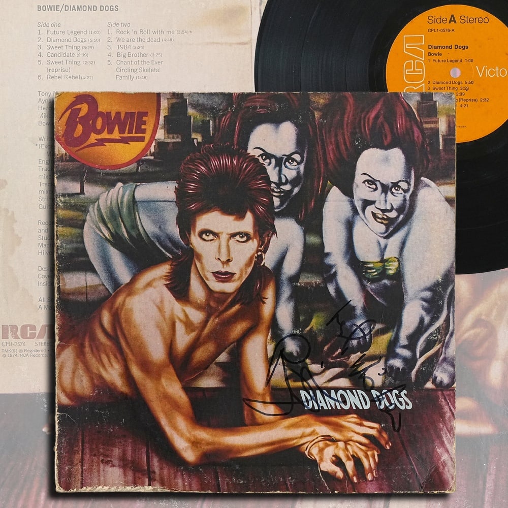 DAVID BOWIE SIGNED "DIAMOND DOGS" U.S. FIRST PRESSING LP: 12 1/4 x 12 1/4 in Provenance and Authentication: This collectible has undergone a rigorous forensic evaluation. The signatures were carefully analyzed across multiple criteria, including ink depositi