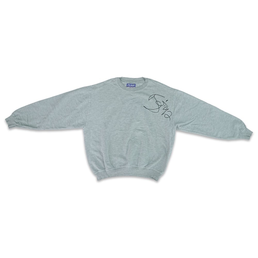 DAVID BOWIE SIGNED GREY CREWNECK SWEATSHIRT, CIRCA 1989-1993: Size XL; Length: 24 3/4 in (63 cm); Sleeve: 22 7/8 in (58 cm); Shoulder: 22 7/8 in (58 cm) Provenance and Authentication: According to the accompanying documentation provided by the consignor, the