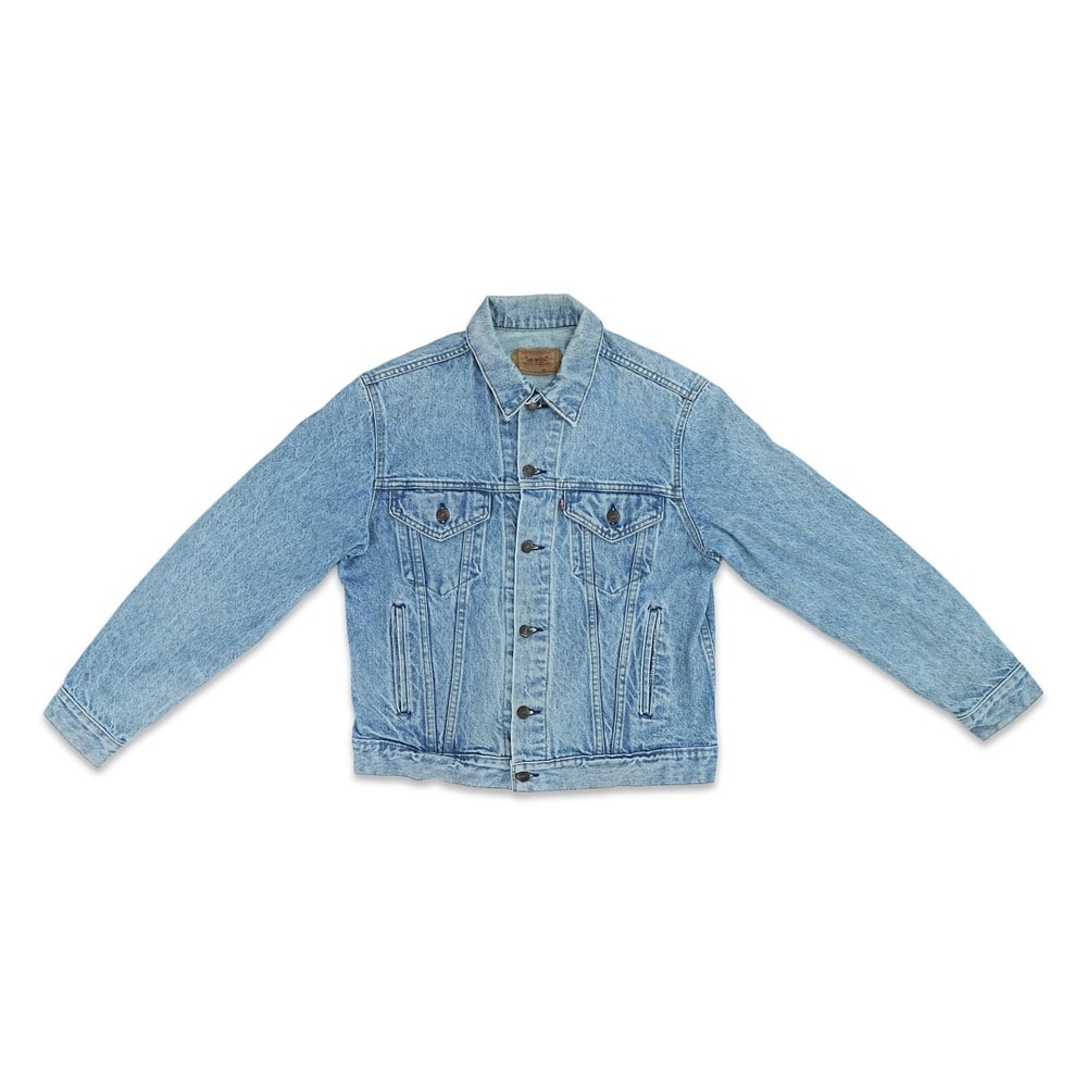 NIRVANA FULLY SIGNED LEVI'S TYPE III DENIM TRUCKER JACKET: Size 42R; Length: 23 5/8 in (60 cm); Sleeve: 23 1/4 in (59 cm); Shoulder: 18 1/8 in (46 cm) Provenance and Authentication: According to the accompanying documentation provided by the consignor, the