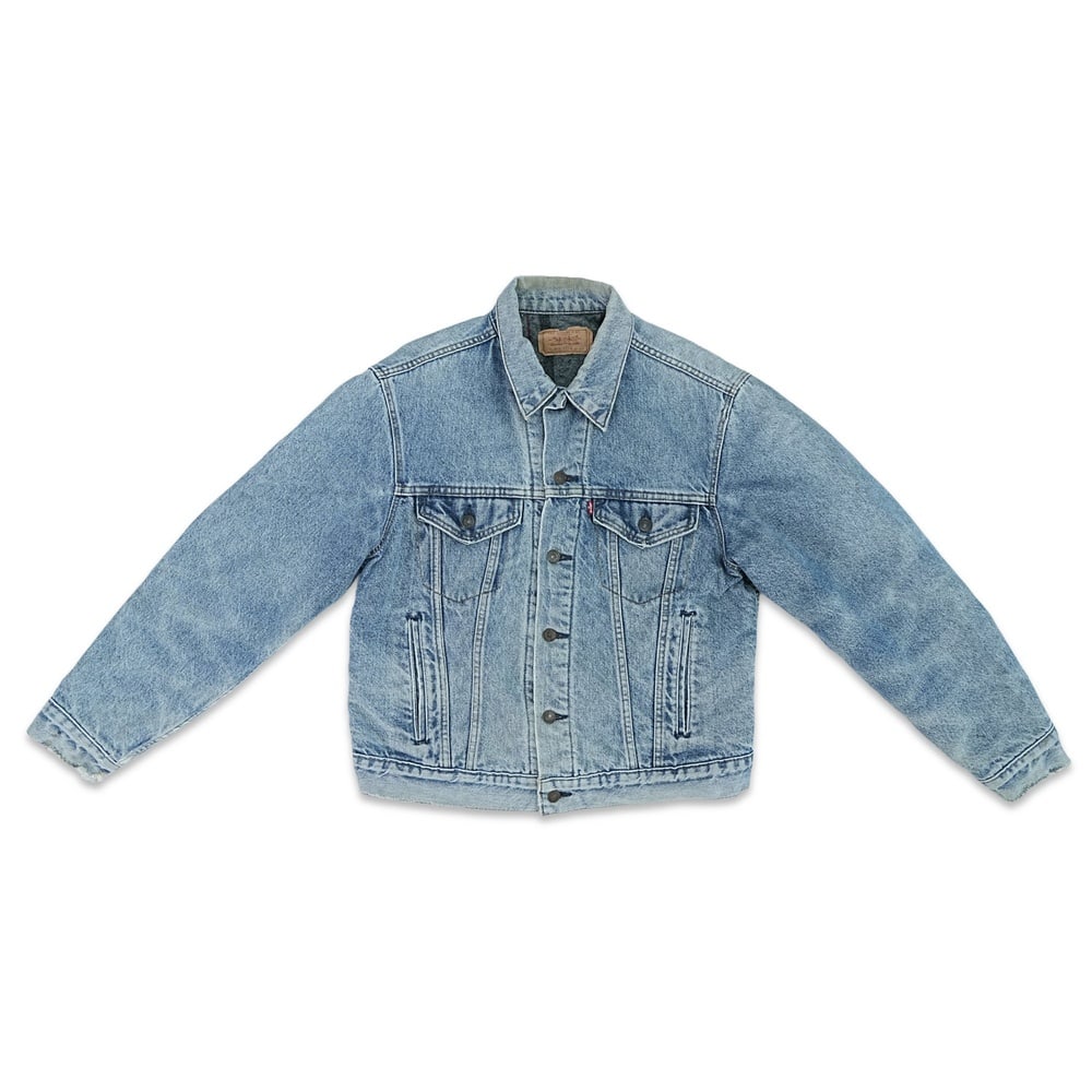 KURT COBAIN SIGNED LEVI'S TYPE III DENIM TRUCKER JACKET: Size 42; Length: 23 5/8 in (60 cm); Sleeve: 23 1/4 in (59 cm); Shoulder: 18 1/8 in (46 cm) Provenance and Authentication: According to the accompanying documentation provided by the consignor, the