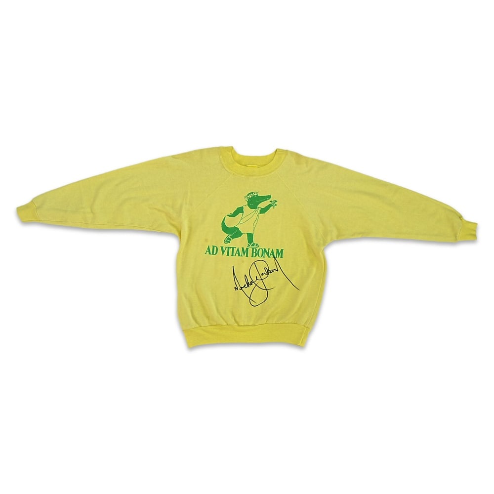 MICHAEL JACKSON SIGNED 1980s AMERICAN-MADE YELLOW SWEATSHIRT: Size L 42-44; Length: 24 in (61 cm); Sleeve: 26 in (66 cm) Provenance and Authentication: According to the accompanying documentation provided by the consignor, the signatures have been examined with
