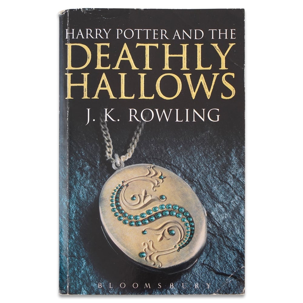 J. K. ROWLING SIGNED "HARRY POTTER AND THE DEATHLY HALLOWS" FIRST EDITION, FIRST PRINTING (PAPERBACK: 7 x 4 3/8 in (17.7 x 11 cm) Signed on the title page by J. K. Rowling, this copy of Harry Potter and the Deathly Hallows is the First Edition, First Printing of the paperback edition, published by